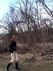 15 pictures - Brunette girl pulls down her trousers to pee outside