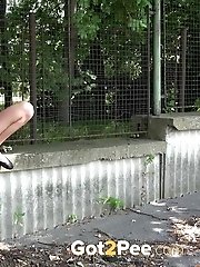15 pictures - Sexy dark haired babe pisses outside