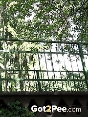 15 pictures - Desperate to pee lady crouches to piss outside