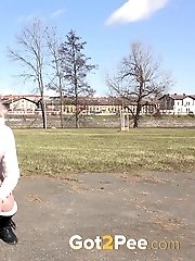 15 pictures - Blonde in glasses squats outside to piss