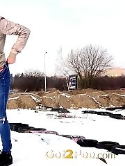 15 pictures - Pretty babe squats in the snow and pisses outside