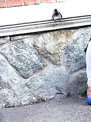 15 pictures - Hot blonde sprays golden piss onto a cobbled path