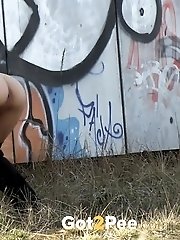 15 pictures - Pretty dark haired girl shows her ass to pee