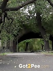 15 pictures - Gorgeous European lifts her leg to piss outside