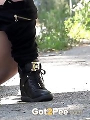 15 pictures - Gorgeous brunette pisses outside on a main road