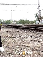 15 pictures - Next to a train line this hottie pisses