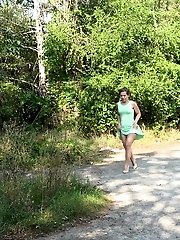 15 pictures - Short haired brunette wipes after pissing outside