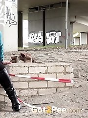 15 pictures - Cute girl in boots pisses outside in the city