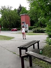 15 pictures - Public pissing for black haired babe in shorts