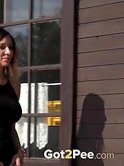 15 pictures - Outdoor pissing for pretty babe who pees in a well