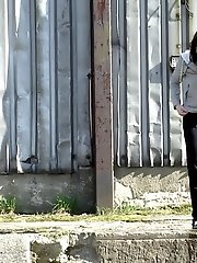 15 pictures - Gorgeous brunette filmed twice pissing outside