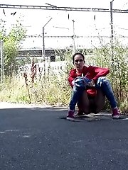 15 pictures - European in glasses squats to piss by railway