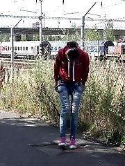 15 pictures - European in glasses squats to piss by railway