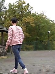 15 pictures - Dark haired girl squats to piss on decking