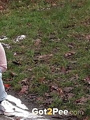 15 pictures - Cute blonde pisses onto snow to melt it