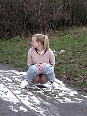 15 pictures - Cute blonde pisses onto snow to melt it
