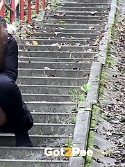 15 pictures - Pretty brunette girl pisses on the steps