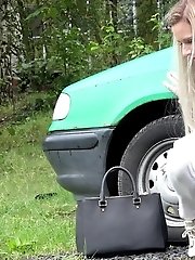 15 pictures - Blonde babe pisses next to a parked car