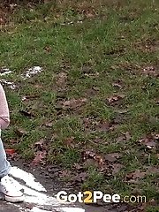 15 pictures - Cute blonde pisses onto snow to melt it