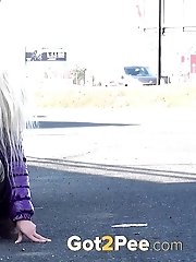 15 pictures - Two girlfriends piss in public next to bus stop