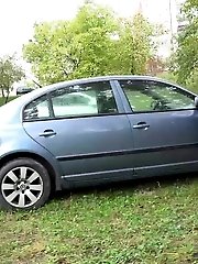 15 pictures - Exotic babe squats behind parked car to piss