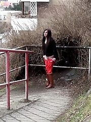 15 pictures - Black haired girl pisses on a public path