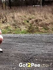 15 pictures - Pregnant brunette pisses on the ground outside