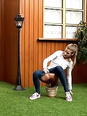 15 pictures - Pretty European relieves herself in plant pot