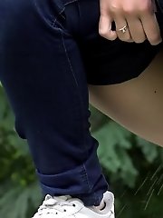 15 pictures - Cute girl pulls down denims to piss