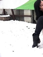 15 pictures - Pretty dark haired girl melts snow as she pees