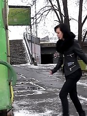 15 pictures - Pretty dark haired girl melts snow as she pees