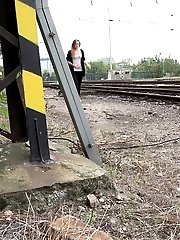 15 pictures - Next to a train line this hottie pisses
