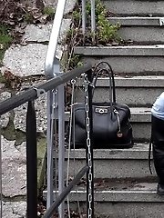 15 pictures - Sexy brunette babe pisses in public on some steps