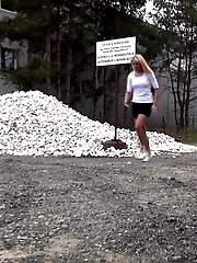 15 pictures - Cute girl pisses onto a pile of rubble