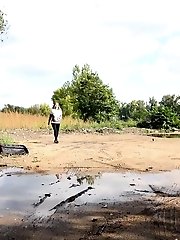 15 pictures - Brunette girl keeps a lookout while pissing