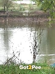 15 pictures - Hot brunette pisses into a flowing river