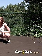 15 pictures - Outdoor pissing for a cute teen on a bridge