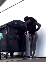 15 pictures - Dark haired girl is desperate to pee when walking