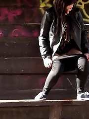 15 pictures - Brunette girl sprays her piss all over the ground