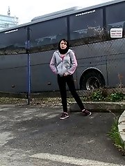 15 pictures - Dark haired girl pisses by a public car park