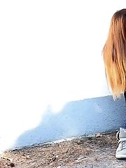 15 pictures - Brunette is all wrapped up while peeing