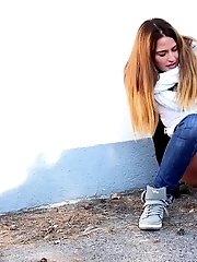 15 pictures - Brunette is all wrapped up while peeing