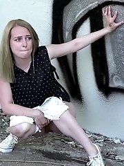 15 pictures - Blonde babe squats and pisses outside near a wall