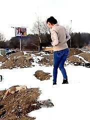 15 pictures - Pretty babe squats in the snow and pisses outside